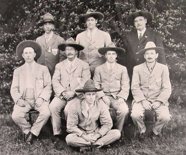 Winners of the International Revolver match. Back row: Walter Winans, R.H. Sayre, C.E. Tayntor. Middle Row: German, C.S. Axtell, J. A. Dietz. On Ground: Thomas LeBoutillier.